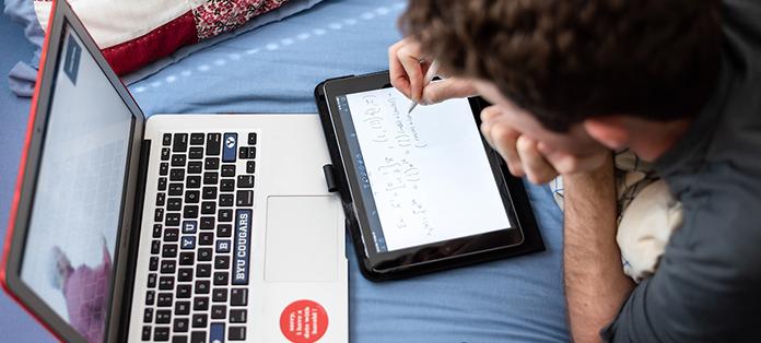 BYU student using laptop and tablet